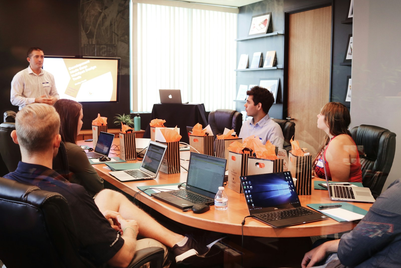 A person presenting to colleagues during a working session